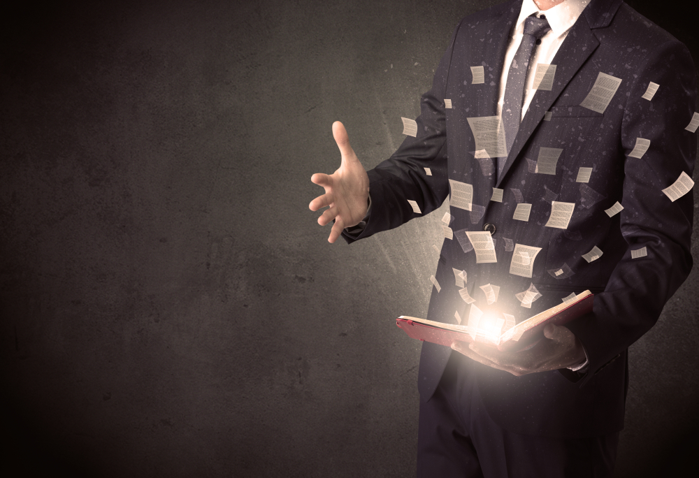 Man,Holding,A,Book,With,Document,Symbols,Around.